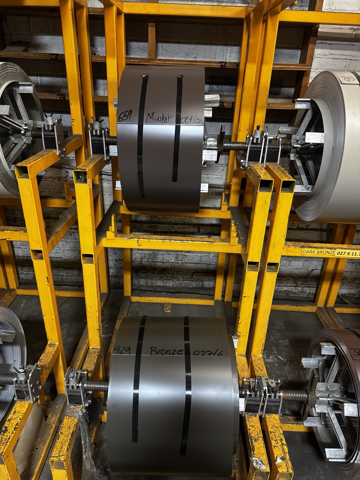 Aluminum gutter coil on a material rack