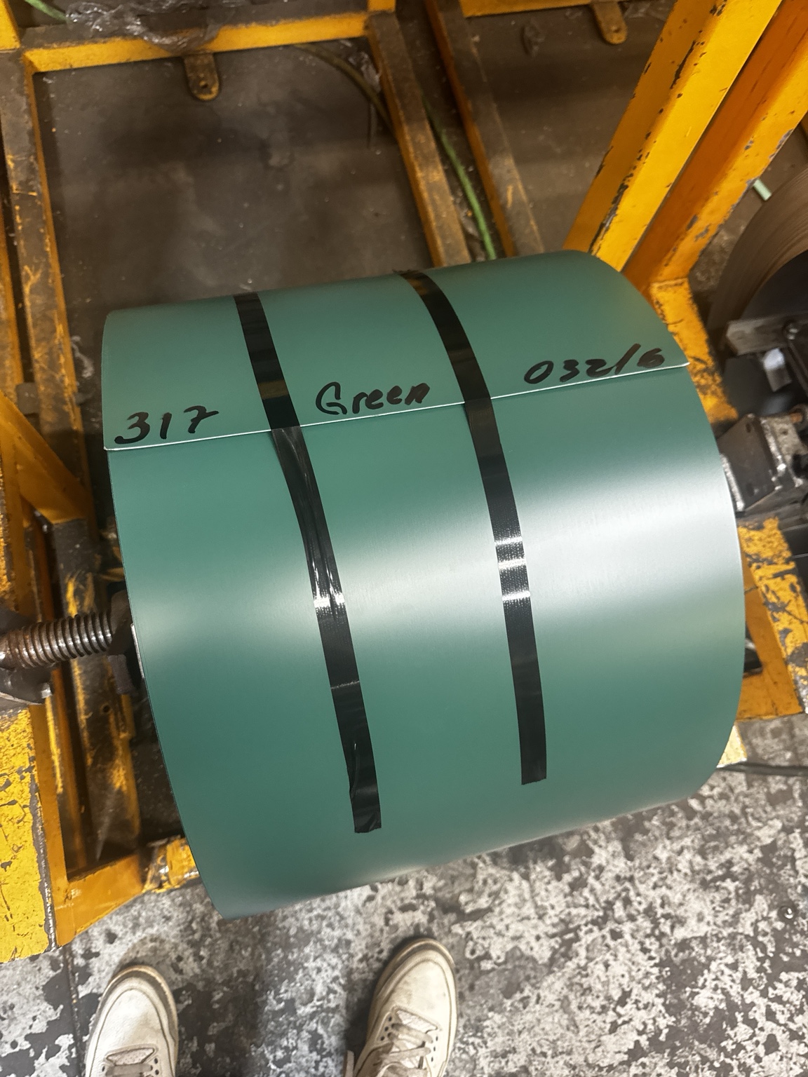 Green gutter coil on a rack